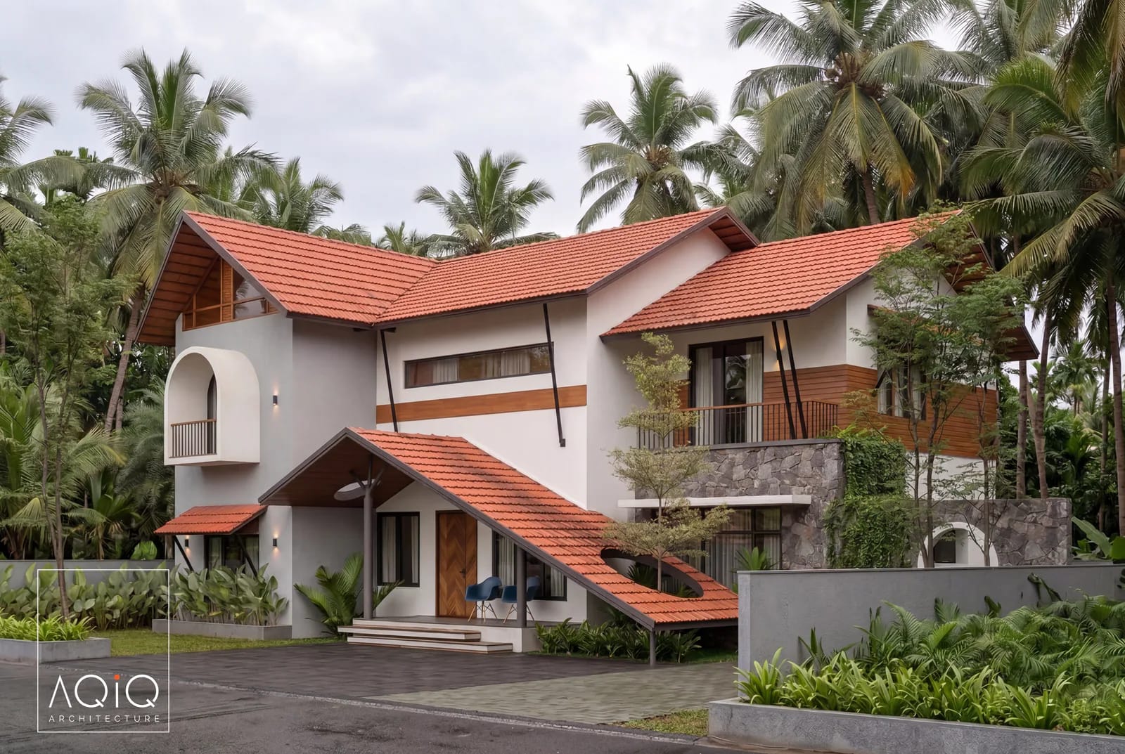 Tropical house with a terracotta roof, timber cladding, and palm trees