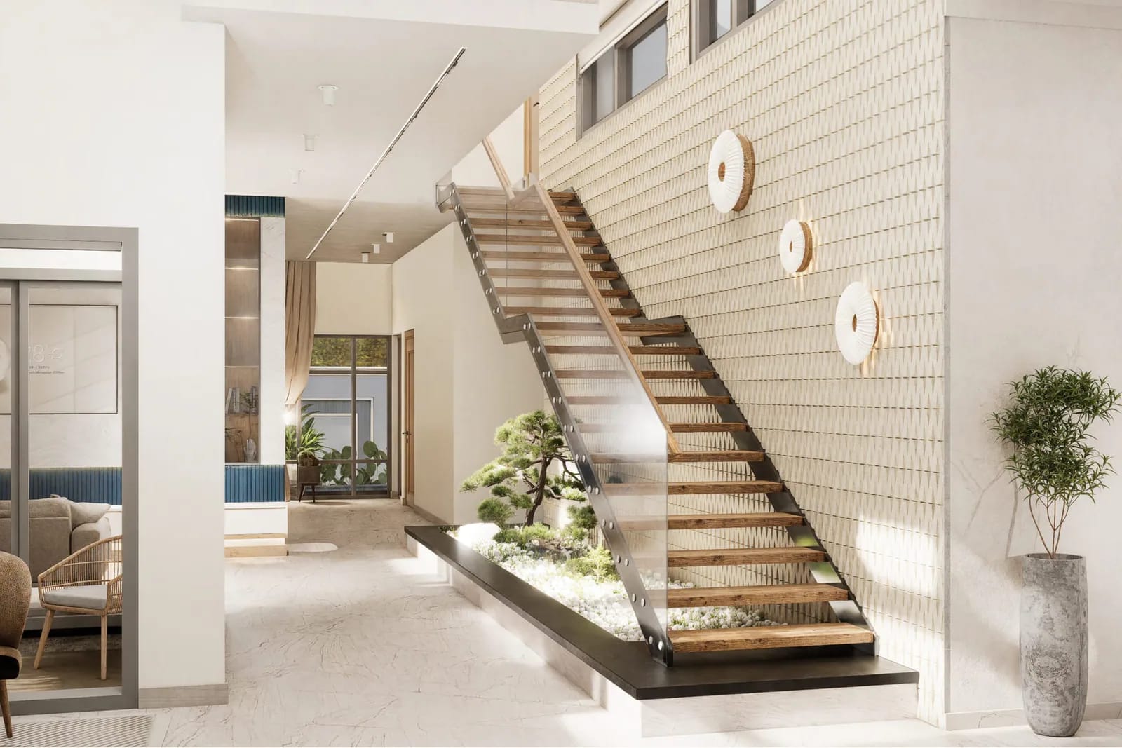 Timber stair with a glass balustrade and a pebble garden underneath